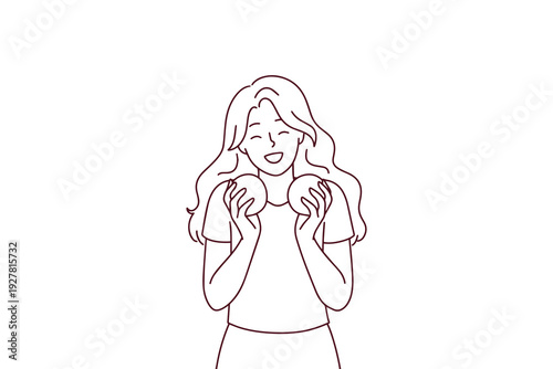 Happy smiling woman holds fresh oranges, symbolizing healthy lifestyle and organic nutrition. Concept of mindful eating, vegan diet, and natural vitamin source without gmo for wellness.