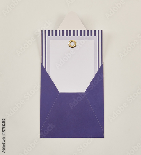 Beautiful floral arrangements: a hand-held bouquet of orange and white roses, and a pink tulip arrangement in a decorative striped box against a white brick wall.