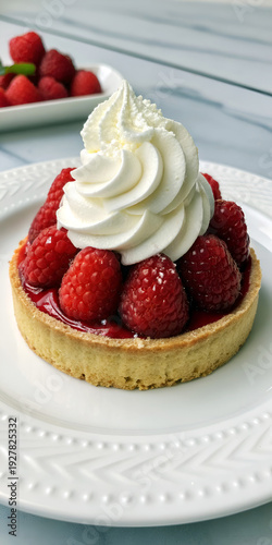 Gourmet Raspberry Tart with Whipped Cream Garnish.