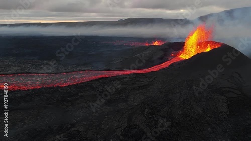 Wallpaper Mural Volcanic eruption glowing lava flow streaming from crater, dramatic smoke and fire, raw natural phenomenon in Iceland Torontodigital.ca