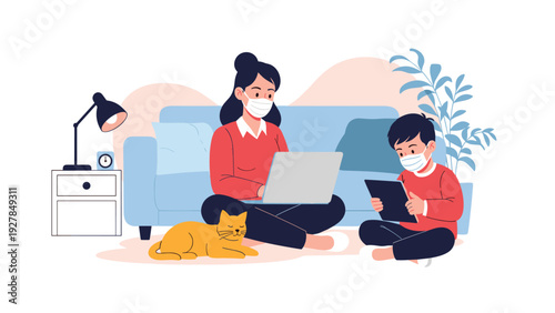 Mother and son wearing protective masks work together in the living room with their cat during a period of social distancing at home.