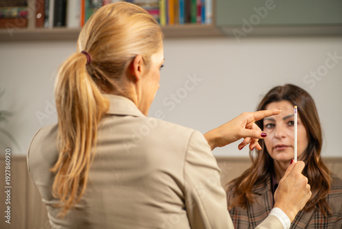 EMDR session applying pen-based eye movement to activate bilateral brain stimulation. Shows focused visual engagement and clinical safety.