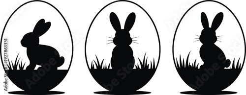 Easter bunny silhouette collection inside egg frames with grass, black rabbit shapes isolated on white background, spring holiday illustration set