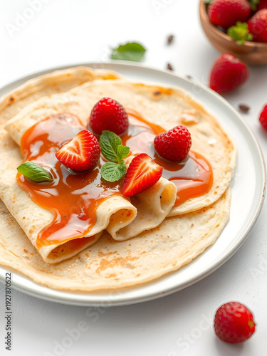 fresh hot blinis or crepes isolated on white