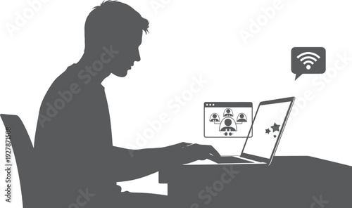 Man sitting at desk working on laptop with wifi signal