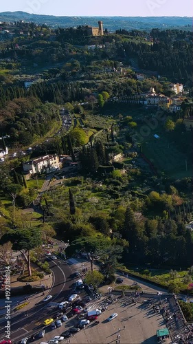 4K aerial vertical video of Florence outskirts and Piazzale Michelangelo. Aerial view of winding roads, cypress trees, and Torre del Gallo in Tuscany. Vertical video for Italy travel reels.