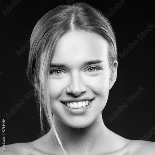 Smiling Girl Isolated on a Black Background. Skincare. Spa.Beauty Model