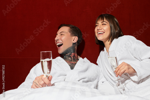 Photography Young couple enjoying blissful moments together in a cozy hotel suite