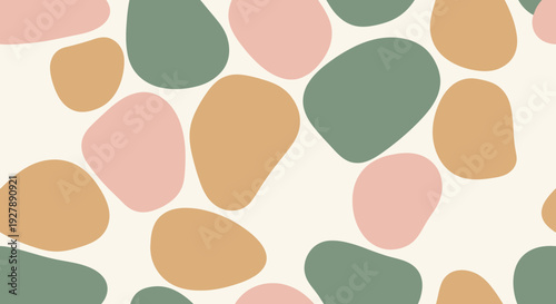 Seamless abstract pattern featuring organic, irregular pebble shapes in muted pink, green, and brown tones on a light cream background.