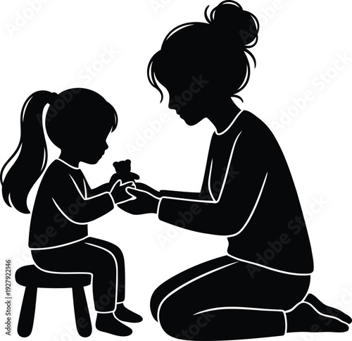 Woman helping child tie shoe lace sitting on small stool