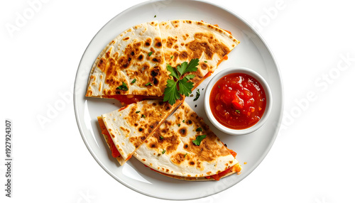 A plated quesadilla cut into triangles, with salsa dip & parsley garnish