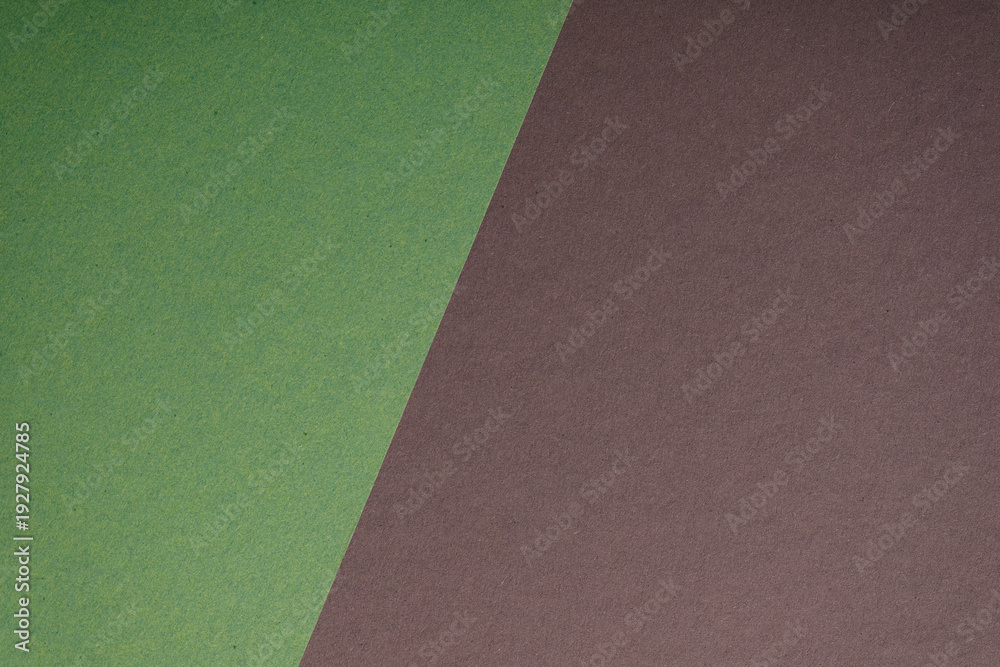 Fototapeta premium Abstract background featuring a diagonally split image of green and brown textured paper. Perfect for minimalist design,