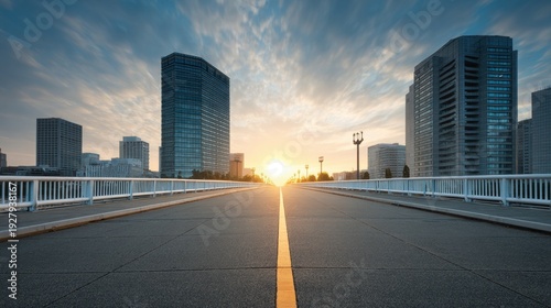 Beautiful Cityscape at Sunrise with Dramatic Clouds Over Empty Wide Road and Modern Architecture Surrounding