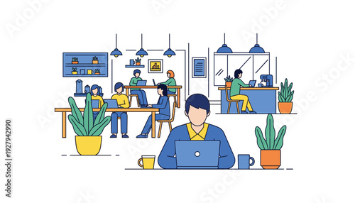 Modern office workspace with people working on laptops