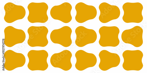 Abstract arrangement of irregular golden yellow shapes on a white background