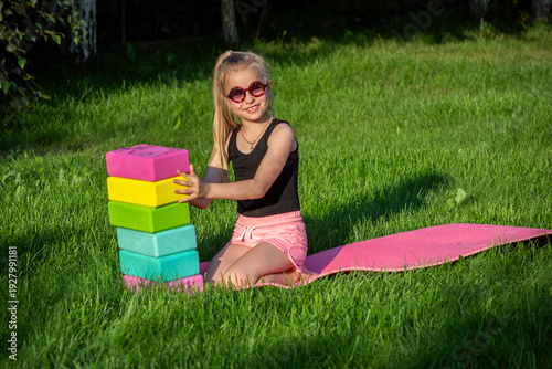 A young gymnast trains outdoors.