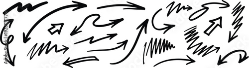 A collection of hand-drawn arrows and scribbles in black ink on a clean surface viewed from directly above