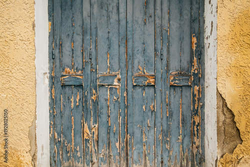 Close up of rustic old weathered shutters in Provence France 