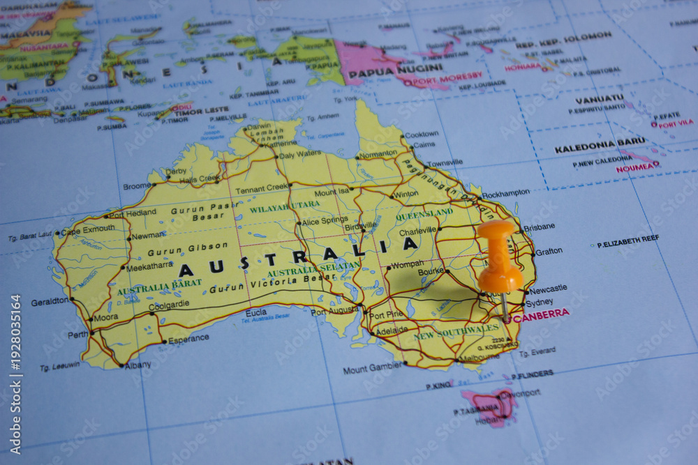 Fototapeta premium Map pin pointing to Canberra, Australia, symbolizing capital city location, navigation, travel planning, geography, and national government center