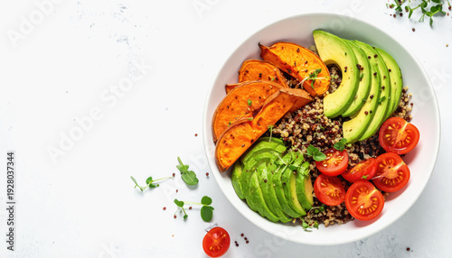 Vibrant Quinoa Bowl with Roasted Sweet Potatoes, Avocado Slices, and Tomatoes