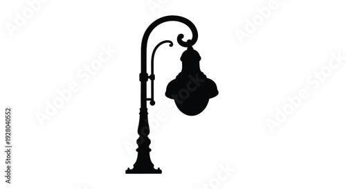A silhouette of an ornate vintage street lamp against white
