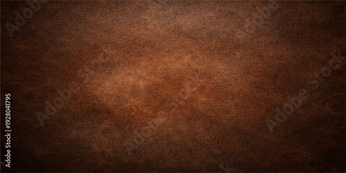A dark brown grunge leather texture with a vintage aged pattern creates a rough textured backdrop of antique material for a dark retro wallpaper design