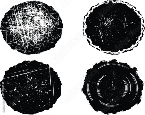Set of four black round grunge textures with distress effects and scratched surface for vintage design work