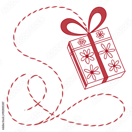 Gift box with floral pattern and red string flowing in a playful swirl traditional spring holiday decoration