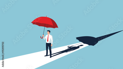 Businessman holding a red umbrella which casts a long sharp shadow representing protection against hidden risks.