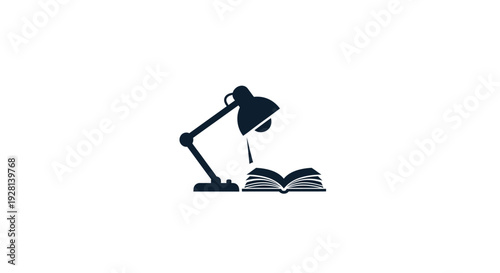 Desk lamp on open book.