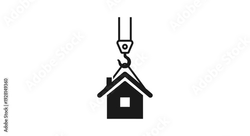 House being lifted by crane hook.