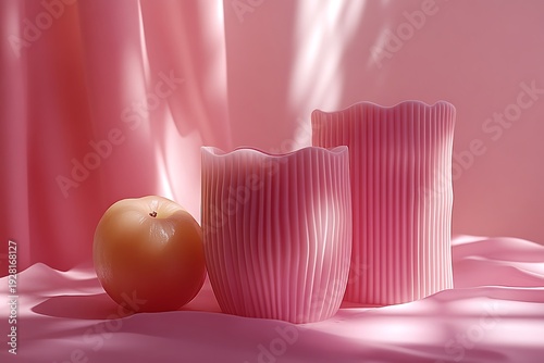Wallpaper Mural Two tall pink wavy candles and a yellow apple sit together on soft draped pink fabric Torontodigital.ca