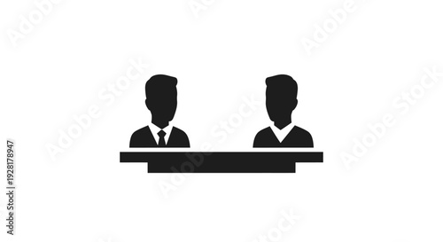 Two Businessmen Sitting at Desk.