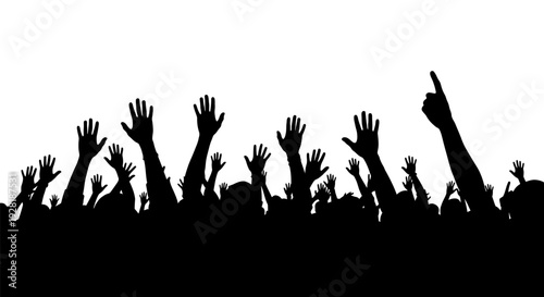 Silhouetted crowd of people raising their hands in excitement.