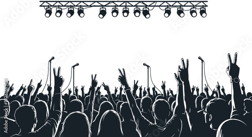 Crowd at a concert with hands raised in the air.