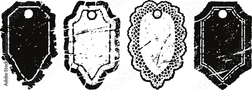 Set of four vintage distressed blank price tags with varied shapes and scalloped edges