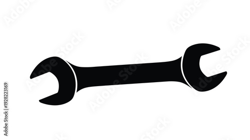 Black wrench tool icon in a stark minimalist silhouette