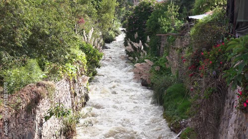 Wallpaper Mural View of the Urubamba River flowing through the Sacred Valley alongside the Ollantaytambo town, Peru. Torontodigital.ca