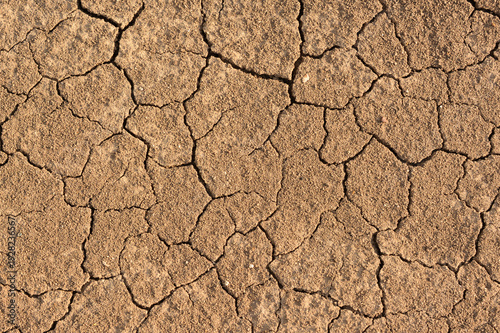 Cuadro en lienzo Dry, Cracked Earth Surface Showing Drought Conditions top view backdrop