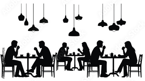 People dining at a table with hanging lights a dark silhouette