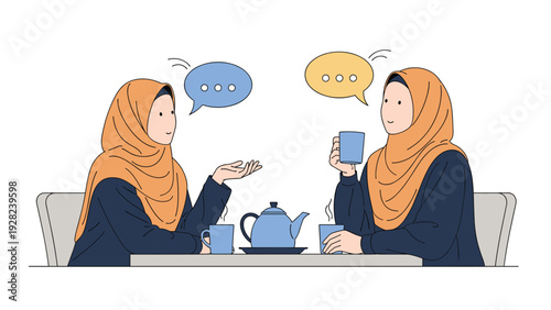 Two muslim women wearing hijabs are sitting at a table and having a conversation while enjoying a cup of tea together.