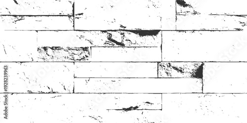 Black and white textured stone wall with rough surfaces and visible mortar lines