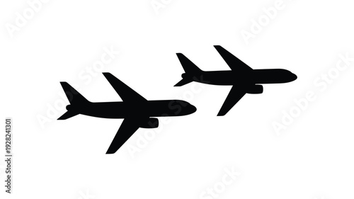 Two airplanes flying in the sky a striking black silhouette