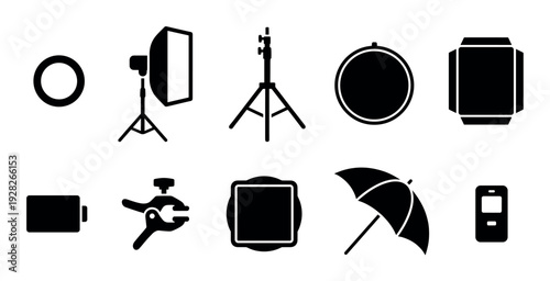 Black glyph icons of photography studio equipment including a softbox, tripod, umbrella, and reflector for professional lighting setups, presented in a minimalist vector style