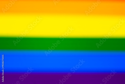 A vibrant abstract background featuring blurred horizontal stripes of rainbow colors, symbolizing diversity and inclusion. Perfect for welcoming themes in events and campaigns.