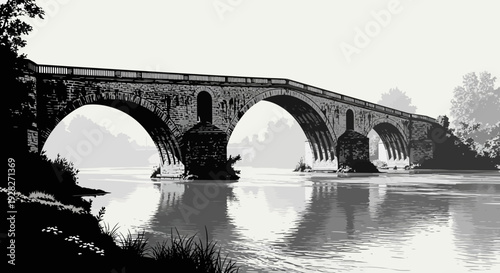 Stone bridge spanning river in monochrome architectural silhouette