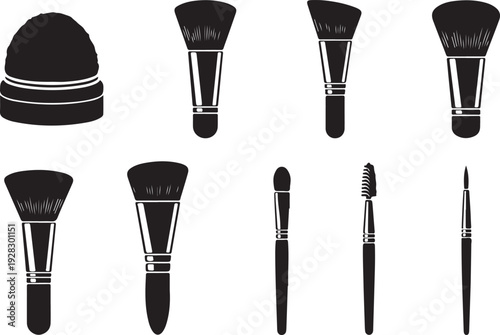 Assorted makeup brushes and tools displayed in a row against a white background