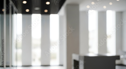 Modern office interior with blurred furniture and curtains