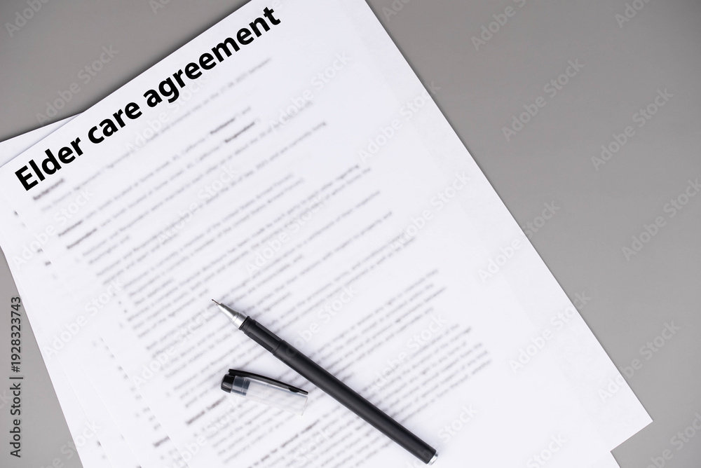 Obraz premium Elder care agreement contract on desk, legal document for senior caregiving services, family support and healthcare responsibility concept.