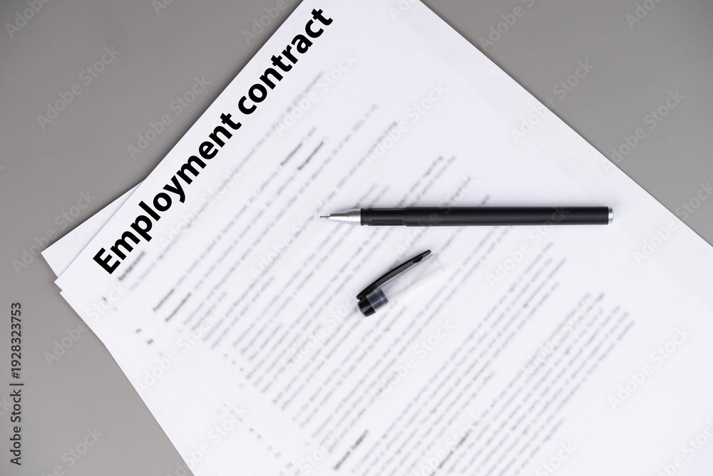 Obraz premium Employment contract document on office desk, legal agreement for hiring, job offer, and professional business relationship concept.
